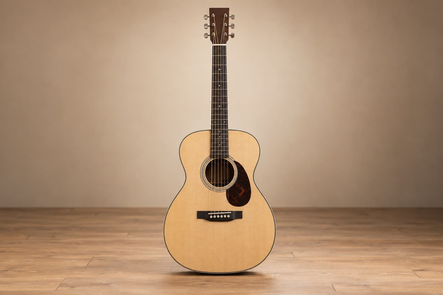 Front view of a compact OM orchestra model acoustic guitar
